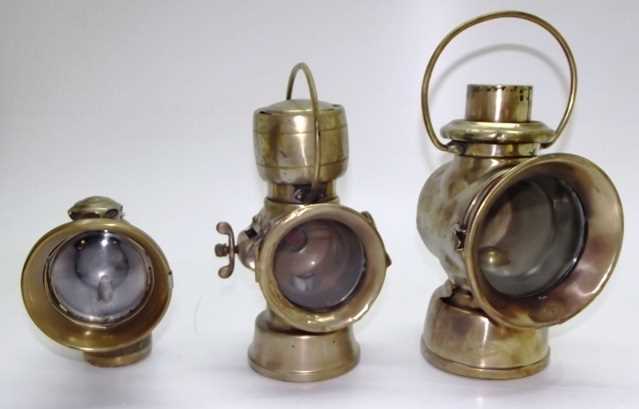 Lot 53 - Three early Lucas brass lamps