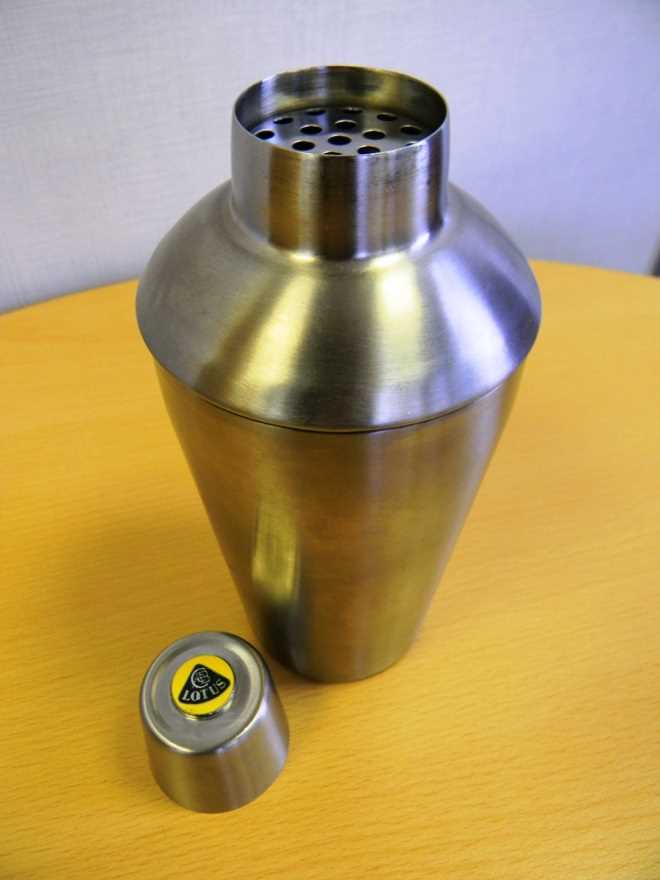 Lot 160 - a large stainless steel cocktail shaker for Lotus cars
